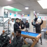 Young people playing pool