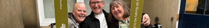 three people smiling